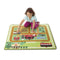 Kids will be kept busy at work on this colourful farm-themed play rug from Melissa and Doug! Provides endless hours of fun with three flocked farm animal play figures (cow, pig, horse) and a wooden farm tractor and trailer, and features details like a barn, stables, farmhouse, chicken coop, pond, crops, garden, pasture, orchard, riding arena, trails, and more to give many options for creative play.