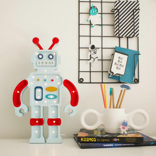 This high-quality metallic blue robot children’s night light is made of 100% natural pine wood. Little Lights are created by hand in a small factory in Krakow. It is not only a beautiful object for everyday use, but also a keepsake that will last throughout childhood and remain in the family for generations.