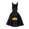 Your little superhero will look the part with this adorable reversible cape that offers twice the fun, with quality design and versatility. The black satin side feature a yellow bat emblem and reverses to a red spider web satin print with spider details. 