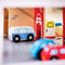 This colourful Park and Play garage from Bijgigs has everything your little driver needs to help them get from A to B. There's plenty of action on every level, where a working lift hauls the cars up to the parking spaces. A service centre, car wash and petrol pump keeps things buzzing on the ground floor, while a down-ramp with lifting barrier provides vehicles with a swift exit when it's time for home. There is even a helipad at the top to park your helicopter!