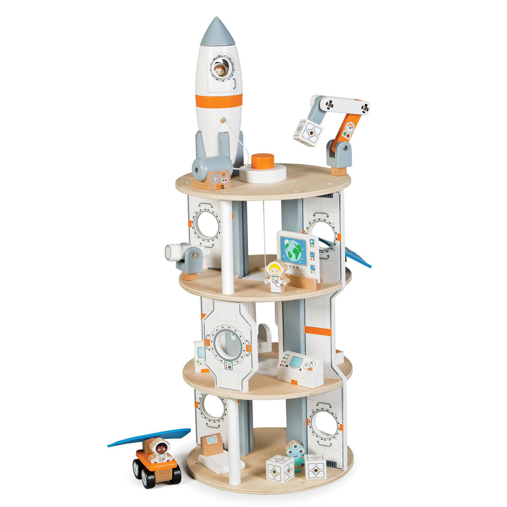 Blast off into space with this 22 piece Space Station playset from Tidlo! Your little astronaut can shoot into space in the rocket that uncouples to simulate a real life rocket take off and docking. As you are nearing your approach jettison the rocket's module and dock with the station's airlocks to climb aboard. Explore the station using the working lift, observe the stars with the telescope and computer equipment, visit the hydroponic garden and get some exercise on the treadmill.