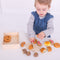 Little ones can safely chop up a variety of bread and pastries with this brightly coloured crate of wooden play food from Bigjigs.