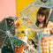 An umbrella illustrated with delightful birds in a spring setting. Its transparent design enables the child to see where he or she is going, and its manual opening fitted with a protection system means that it can be opened and closed without pinching your fingers. A colourful accessory, ideal for brightening up outings in the rain! 