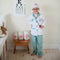 Your aspiring little doctor can look the part with this 8 piece dress-up-and-play set from Great Pretenders! The set includes a white doctor's coat, green scrub pants, a green fabric mask, white hat, play stethoscope, play syringe, and play thermometer. The coat also features a sewn in doctor's name tag holder with removable name tag and velcros on and off.