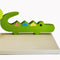 Designed and hand-crafted in Italy, this display shelf with a neutral painted wooden base and crocodile design will bring colour and imagination to your child's bedroom.  Creatively constructed from wood and layered fabric, the vibrant crocodile design is stunning. A quirky and practical way to display items in your child's bedroom. Matches similar products on Rooms for Rascals. 