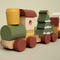 All aboard the Christmas train! Use the different building block shapes to build a Christmas tree in the wagon. This stacking train will improve your little one's hand-eye coordination and stimulate their fine motor skills. The perfect gift for under the Christmas tree and to play with during the holidays.
