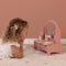 This Little Dutch vanity table comes with a rotating mirror and an array of pretend play beauty products, including a hair brush, perfume, lipstick, eye shadow, nail file and nail polish. It also has a storage drawer to keep (not included) hair bands and clips. Rendered in a pink tone, it’s a nice addition to any playroom. Designed for ages 3 and up.