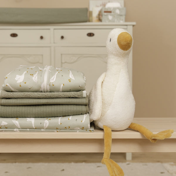 Little Goose is approximately 30 cm high and made of incredibly soft plush. He can sit upright and looks great in any nursery. But he would rather be with you all day; to play, to cuddle and to sleep with you. 