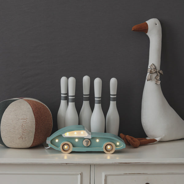 This high-quality retro blue race car children’s night light is made of 100% natural pine wood. Little Lights are created by hand in a small factory in Krakow. It is not only a beautiful object for everyday use, but also a keepsake that will last throughout childhood and remain in the family for generations.