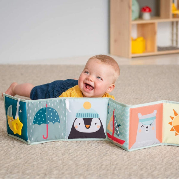 This double sided soft baby book with adorable illustrations and crinkle filling is fantastic for your little rascal’s sensory development. One side is black and white and the other is bright and colourful!  It stands up to encourage tummy-time play as well as reaching and kicking. It can be used in a cot, buggy or flat on the ground!  Includes: baby-safe mirror, crinkling shapes, 3D activities and textured fabrics, with a star teether and moon pouch.