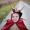 Your little ones can scare, explore and breathe fire with this red and black dragon cape with hood from Great Pretenders! The cape features a soft hood with large gold covered foam scales and ears.
