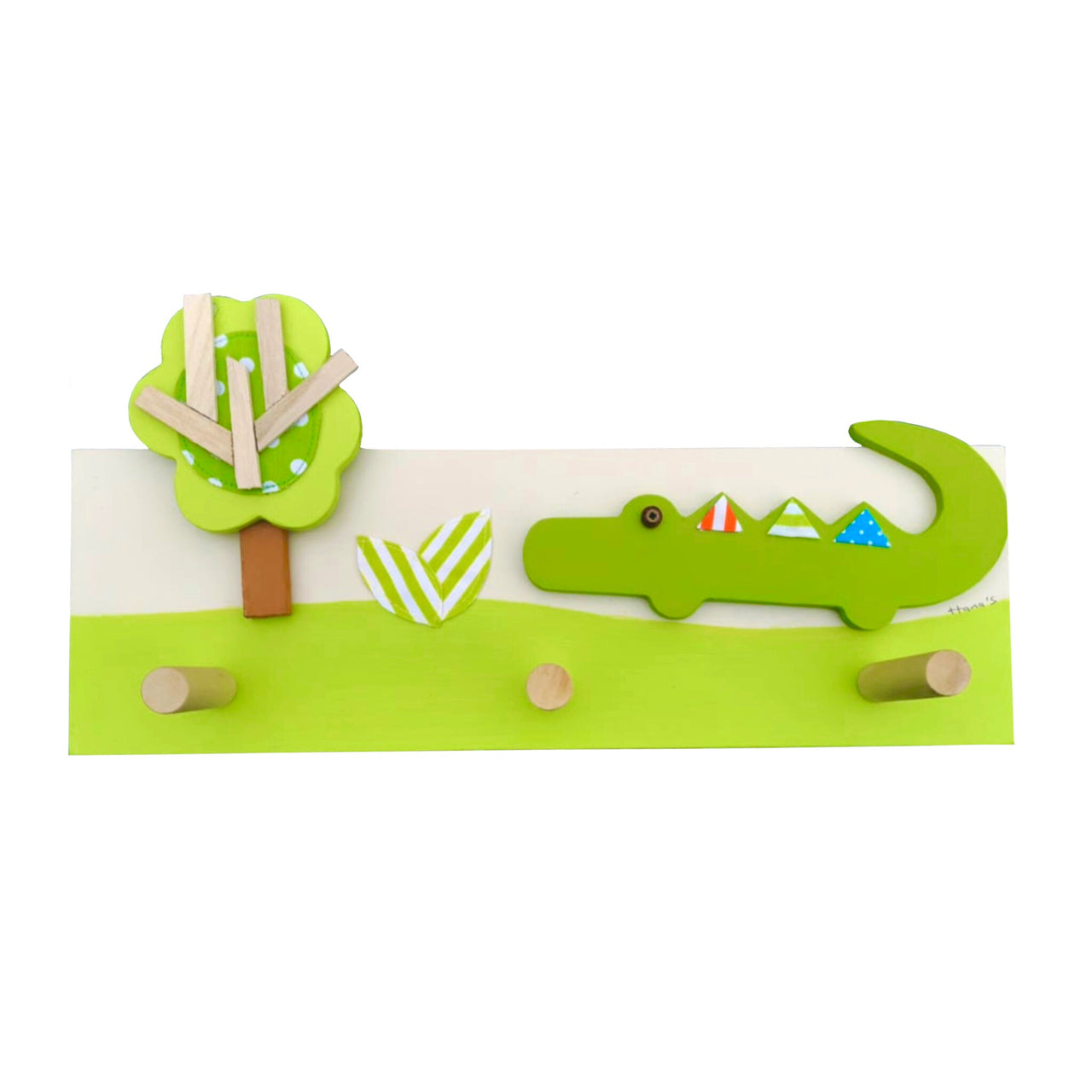 This hand-crafted coat rack has a green wooden base with a colourful crocodile and tree design layered on top. Creatively constructed from wood and layered fabric, the vibrant crocodile design is stunning. It has three wooden pegs for keeping your children's clothes organised.