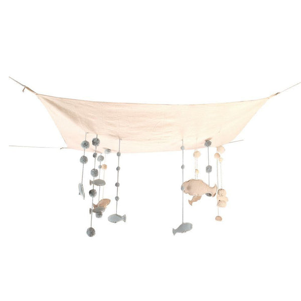 This stunning Sea Sky hanger is made up of a natural undyed cotton canvas fabric, hanging from small cords tiny bubbles and fish-shaped mini cushions. There is a small cotton cord at each end of the canvas so that it may be hung on the bedroom ceiling. Hand-made, each hanger is unique. Thanks to its colors and soft, rounded shapes, this beautifyl sky hanger is perfect for a childrens room or play room!