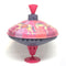This traditional style spinning toy has a stunning circus horse design that your rascals will adore! It is beautifully coloured with shades of pink and orange and an illustration of circus horses with beautiful costumes, running in a circle on top. The spinning top stays balanced as it spins as it has a solid base underneath it. Push the handle up and down to make the top spin. It makes a gentle humming sound as it spins.