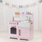 Help your inspiring young chefs cook up a storm with the delightful Pink wooden Country Play Kitchen from Tidlo. This lifelike playset features an oven and hob with clicking dials, a storage cupboard, a Belfast sink, utensil shelves and a clock with moveable hands, to ensure dinner is served on time! 