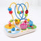 This beautiful, wooden, garden-themed bead frame has a wooden base decorated with illustrations of cute bugs, leaves and flowers. It has a yellow and a blue wire built into it, which loop and intertwine so your rascals can make the beads go up, down over and around in every direction. Some beads include small illustrations matching the theme of the frame while others are solid colours. There are also two small wooden flowers attached to the base coloured pink and orange.