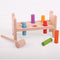 Have hours of fun with the Bigjigs Toys First Hammer Bench! Tap away at the the brightly coloured wooden pegs down through the holes to create a flat workbench. Then, turn it over and start it all again and again! This wooden Hammer Bench is supplied with a sturdy hammer and features gently curved edges. Developing hand/eye co-ordination has never been more fun. Consists of 8 play pieces.