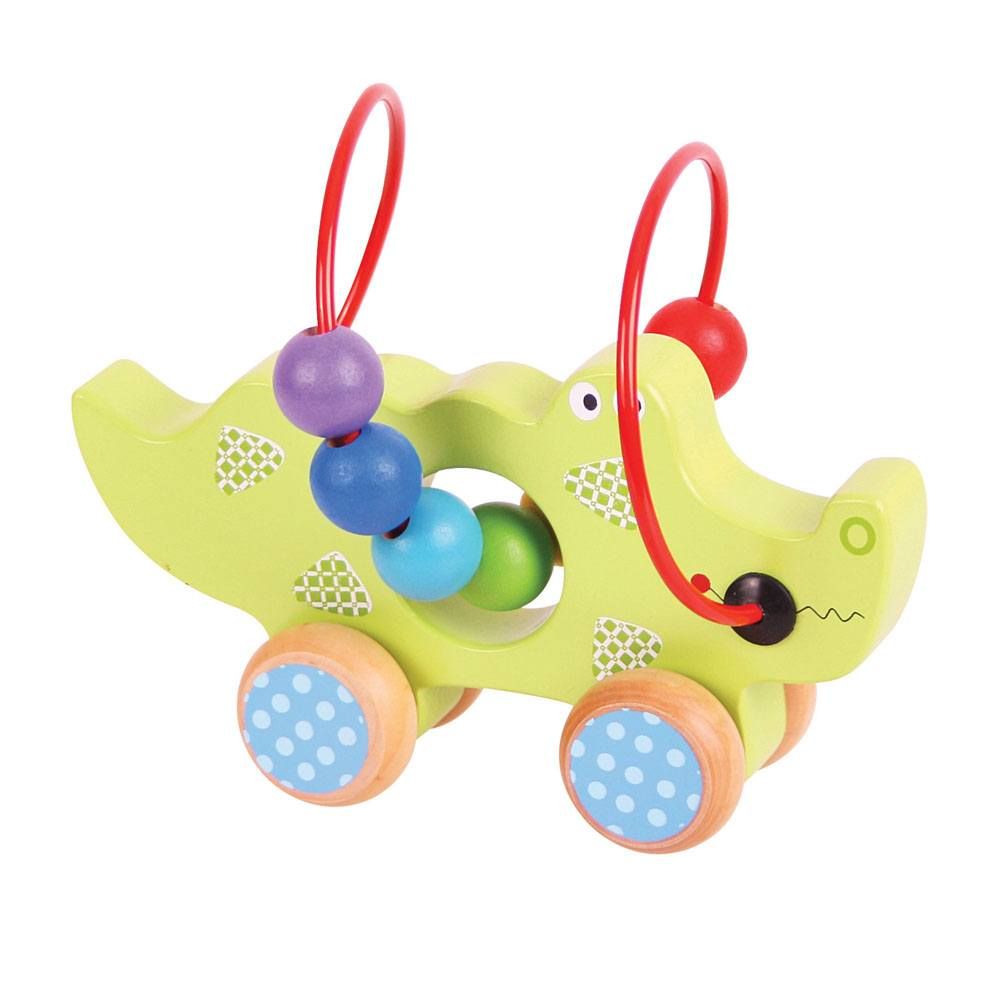 This green wooden crocodile has four wheels at the base and is easily pushed along the floor by small children and babies. The red wire bead frame goes around and through the middle of the crocodile with enough space for the rainbow coloured beads to be pushed through. Made from high quality, responsibly sourced materials.