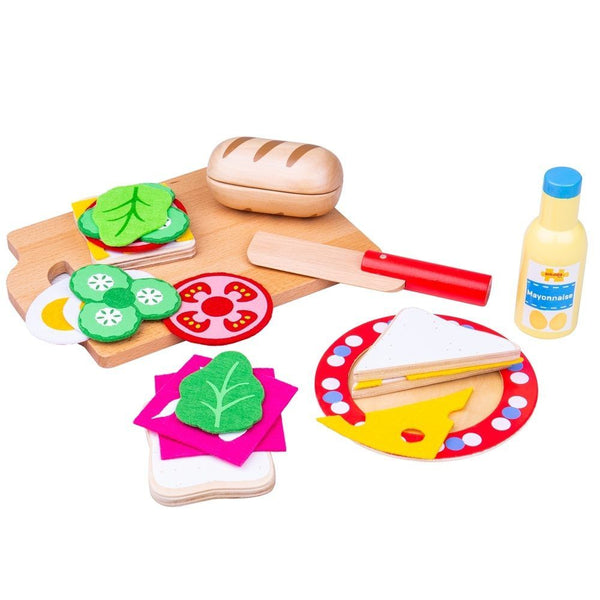 Your little ones can get creative in their pretend cafe with this colourful wooden sandwich making set from Bigjigs! Create a yummy sandwich with the wooden slices and felt fillings. Perfect for interactive role play sessions, to develop vocabulary and learn the importance of a healthy and balanced diet. Includes a plate, chopping board and knife, a ciabatta, bread slices, mayonnaise, lettuce, cucumber, cheese, egg and tomato. Made from high quality, responsibly sourced materials.