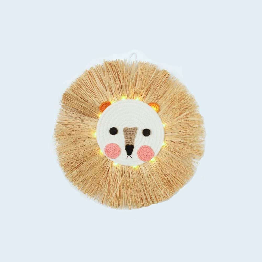 Straw Wall Light .This fun circular wall light would look gorgeous in a children's bedroom or nursery. 12 warm white led lights sit behind the round face of a friendly bear made from crochet and rope with straw 'fur'. The light is battery powered with an automatic timer setting. 