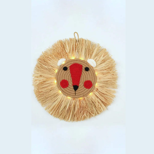 Straw Wall Light .This fun circular wall light would look gorgeous in a children's bedroom or nursery. 12 warm white led lights sit behind the round face of a friendly Lion made from crochet and rope with straw 'fur'. The light is battery powered with an automatic timer setting. 